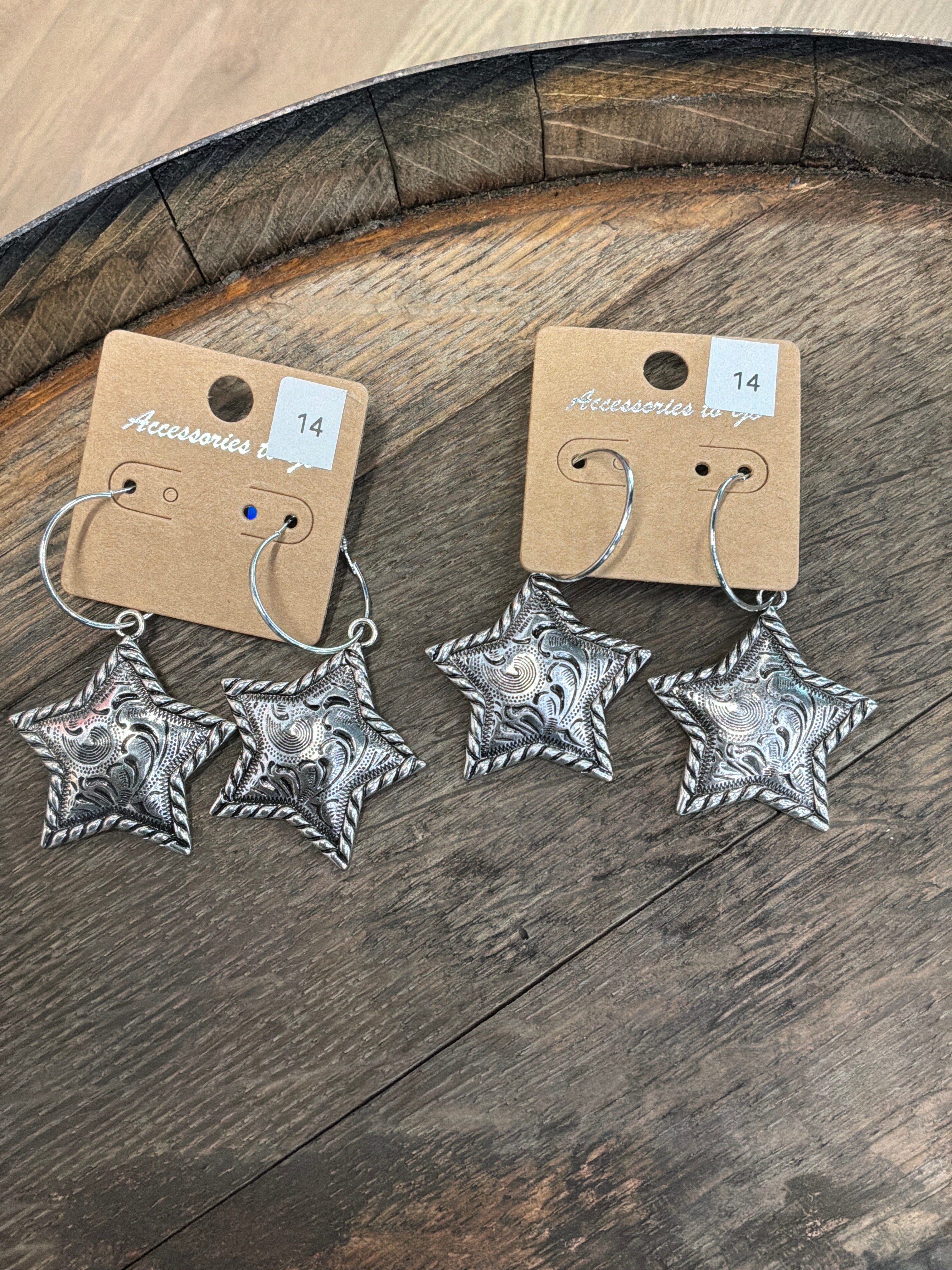 Silver tooled star earrings
